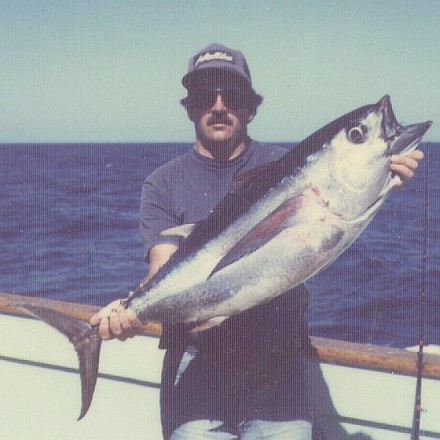 Peter holding a 45-lb bigeye tuna