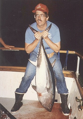 Peter struggling to hold up an 80-lb bluefin tuna