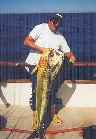 Peter holding a 43-lb dorado