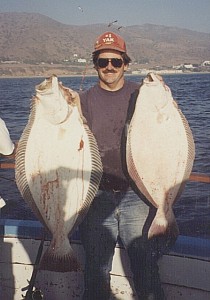 Peter holding two halibut